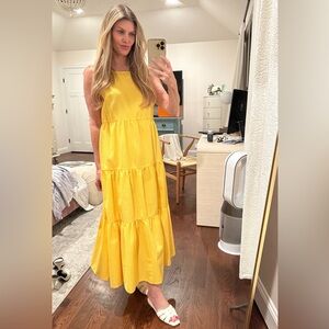 Never worn sunflower yellow dress. Comfortable and easy fit.